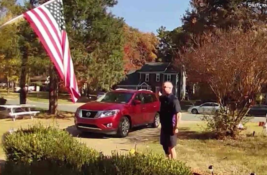 US driver is dubbed ‘an unofficial unofficial of the Welcoming Centre’ after carrying American flag
